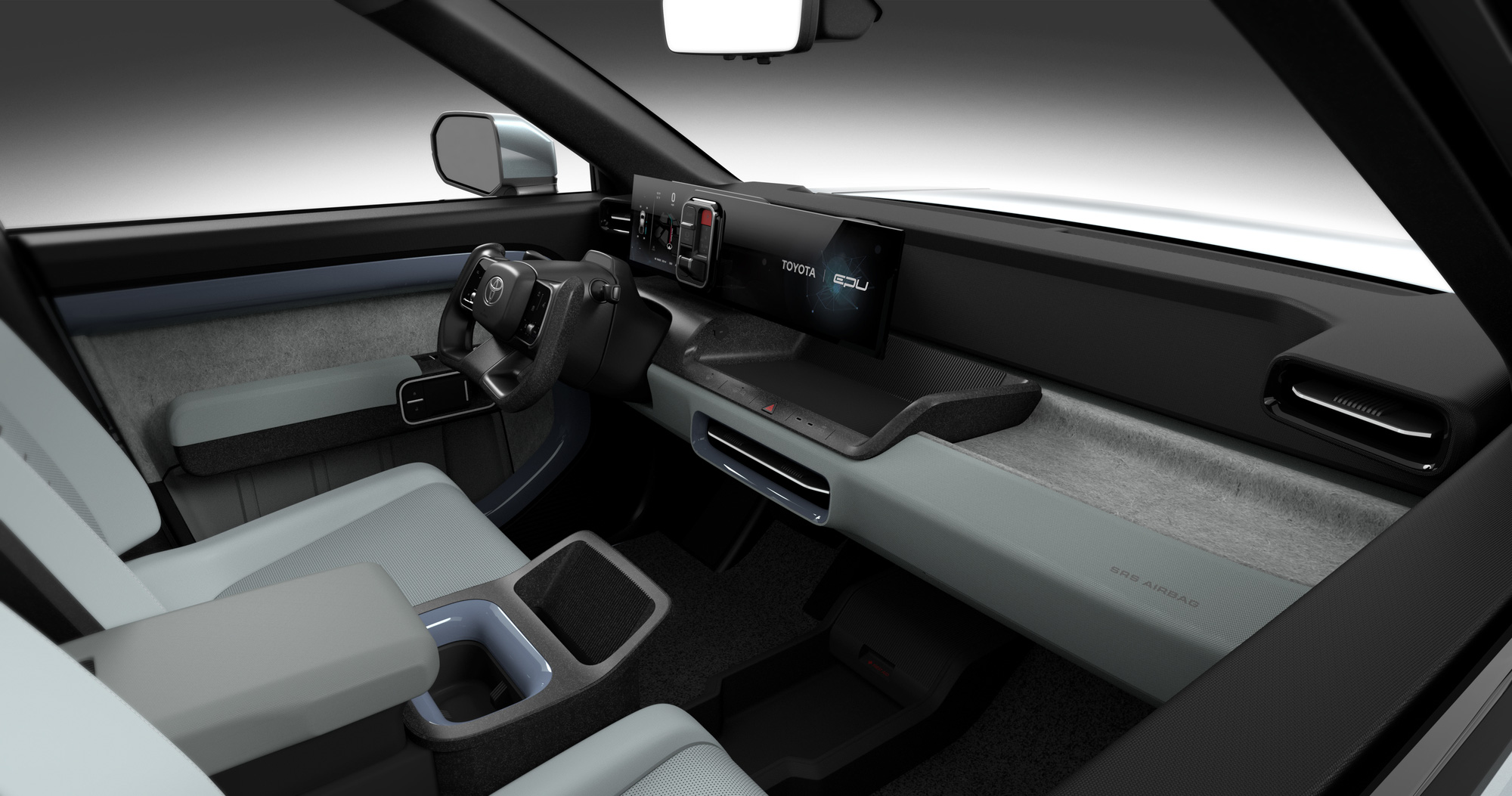 The car's interior has a large storage space between the front two seats as the middle curtain is pulled towards the driver - Photo: Toyota
