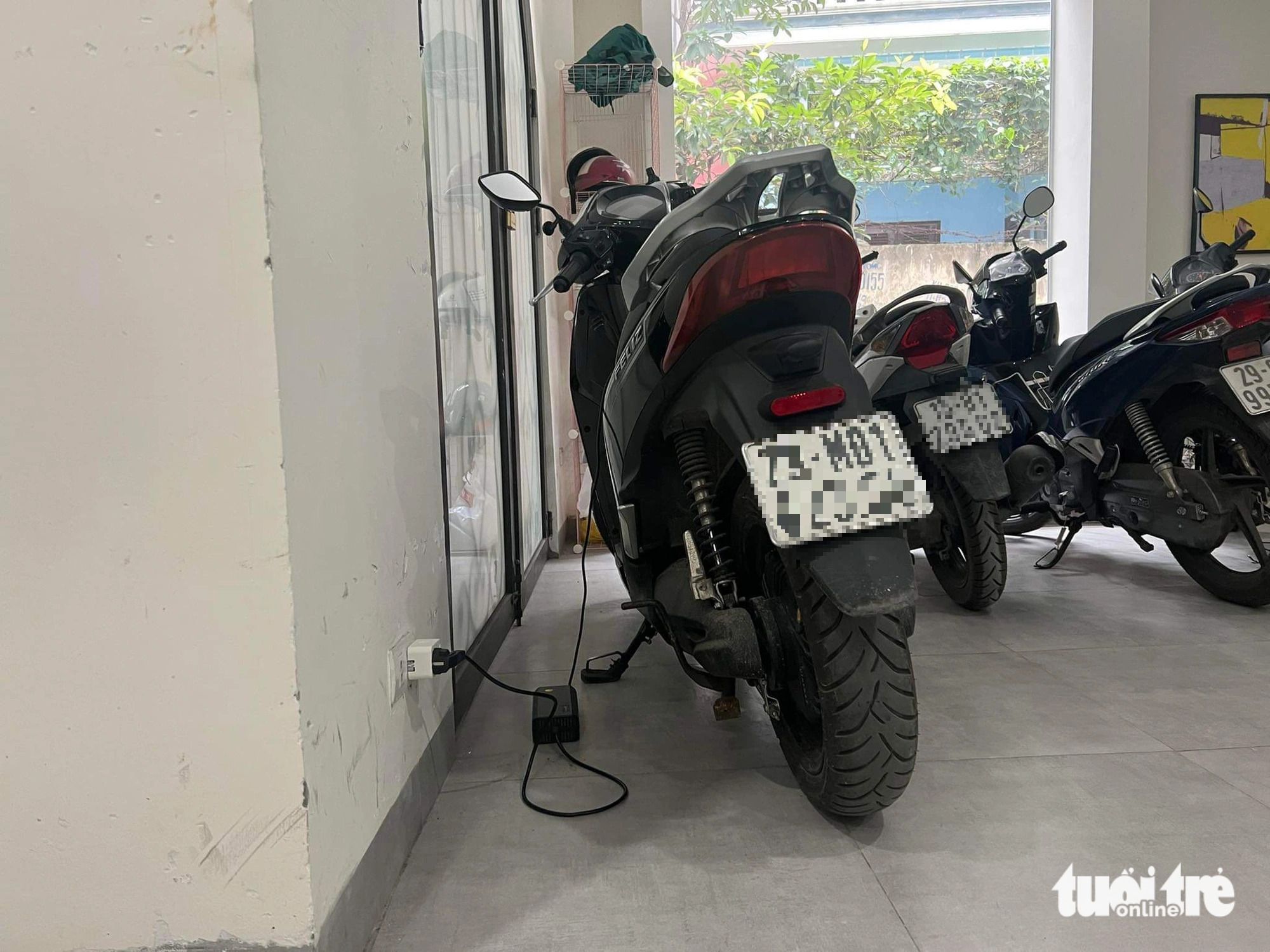 Electric vehicles are charged in a rental house in Hanoi - Photo: PHAM TUAN
