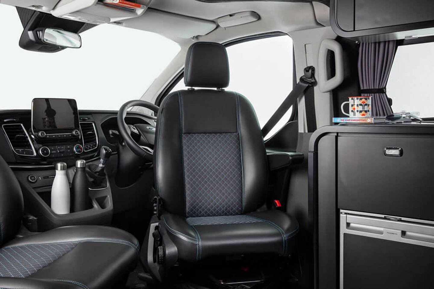 As a Ford Transit Titanium-based mobile home, it has an 8-inch infotainment screen with Apple CarPlay and Android Auto connectivity, and a rearview camera.