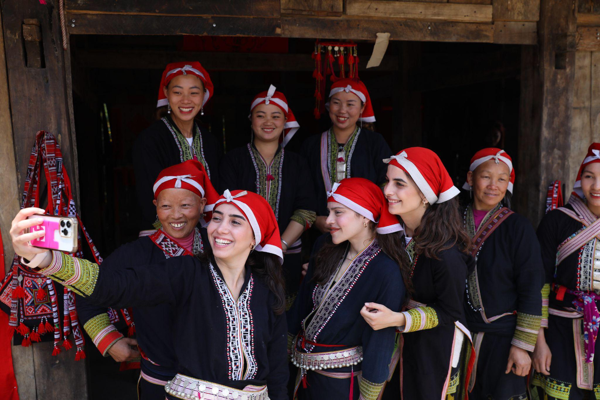 Tourists and Red Dao locals sharing smiles in Sapa!