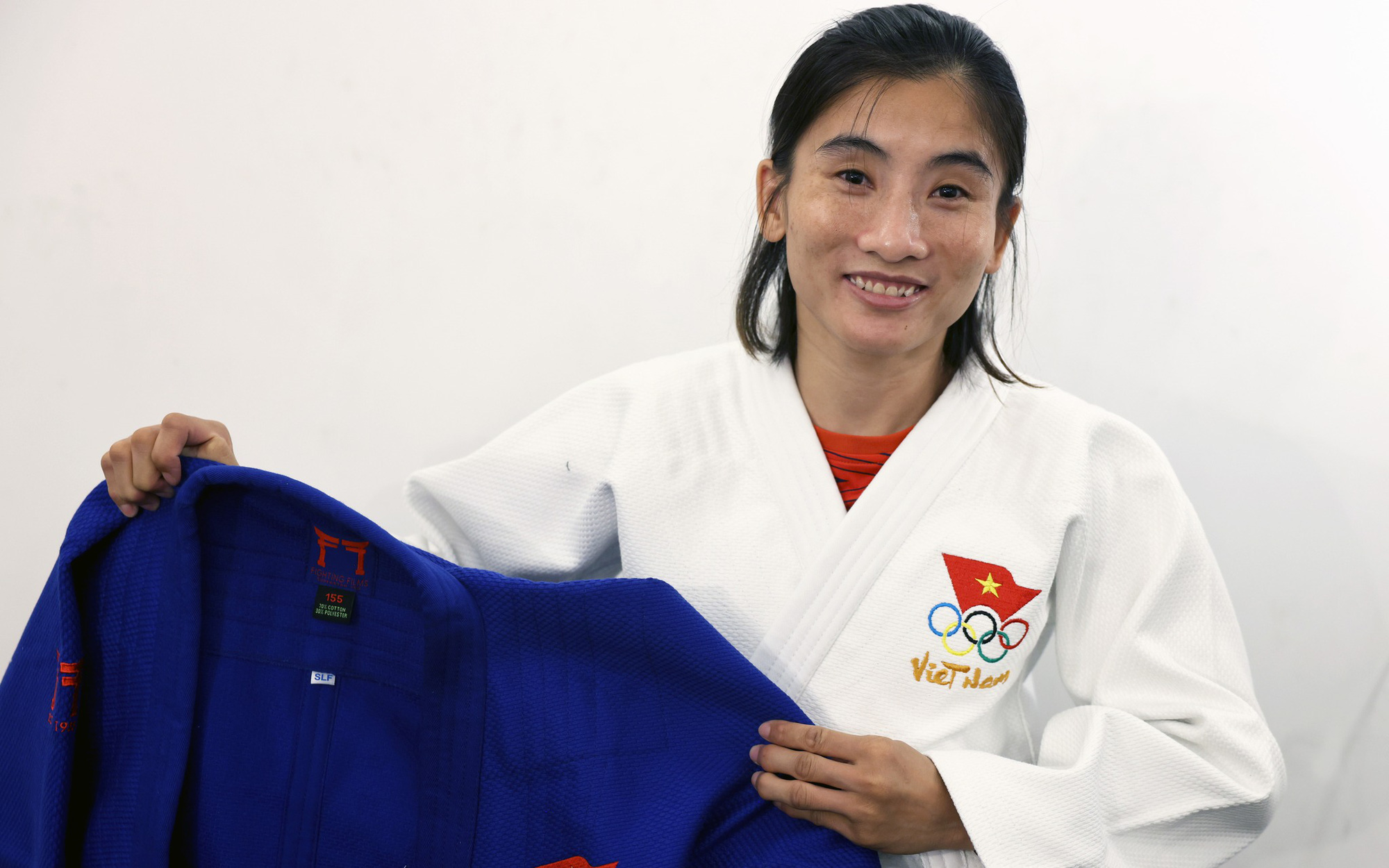 Hoàng Thị Tình và cái duyên với judo- Ảnh 5. Võ sĩ judo Hoàng Thị Tình mang võ phục rất đẹp đến Olympic Paris