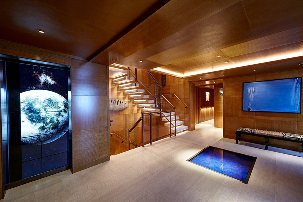 The interior of the Superyacht Symphony was praised as the most detailed at the time the superyacht was born.  The excellent attention to detail is evident in the truly unique elevator shaft, which houses an interactive screen-cum-wall representing a stunning virtual aquarium.  The 15m-high wall is assembled from 25 screens - Photo: Feedship