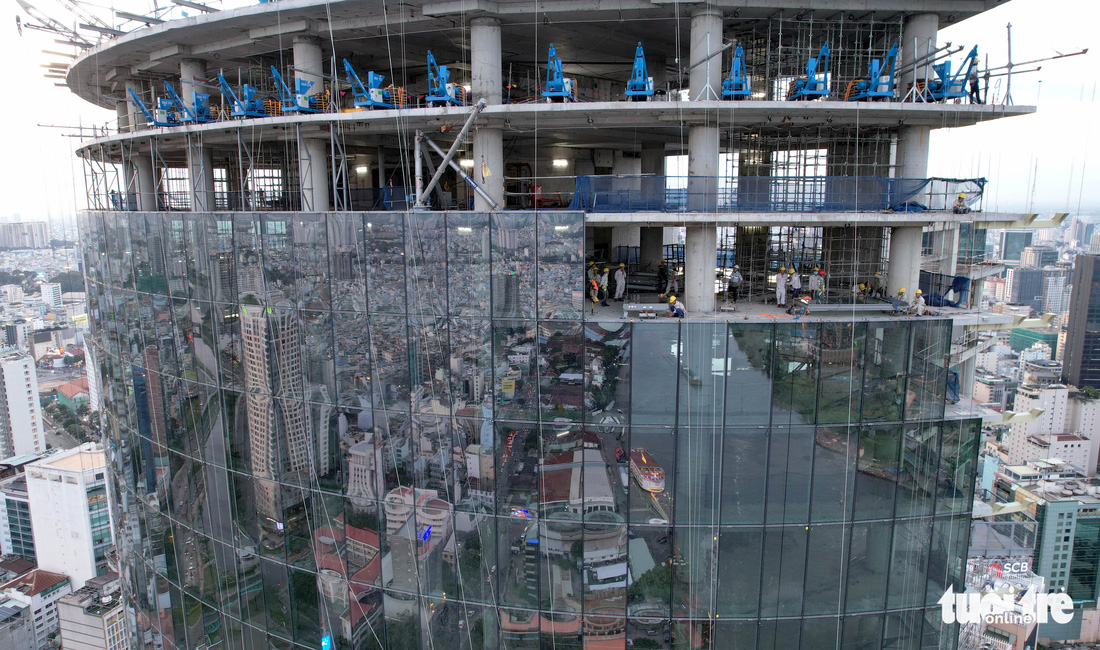 Tòa nhà chọc trời ‘làm xấu bộ mặt TP.HCM hơn 10 năm có chủ mới, đổi tên thành IFC One Saigon - Ảnh 4.