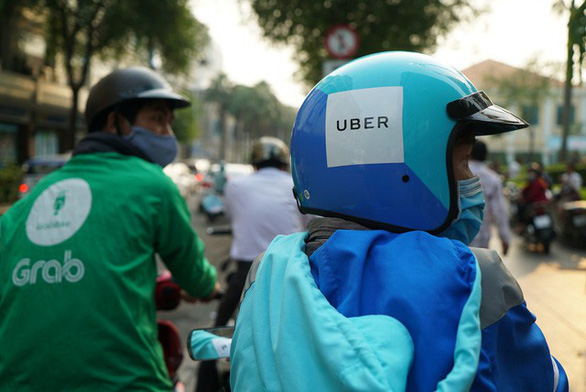 Uber bán thị trường Đông Nam Á cho Grab, Việt Nam thu thuế ra sao? - Ảnh 1.