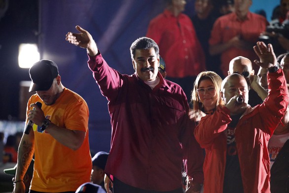 Kinh tế Venezuela điêu đứng, ông Maduro vẫn tái đắc cử - Ảnh 1. Kinh tế Venezuela điêu đứng, ông Maduro vẫn tái đắc cử - Ảnh 1.