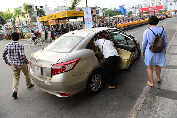 Siết chặt Uber, Grab… - Ảnh 1. Siết chặt Uber, Grab… - Ảnh 1.