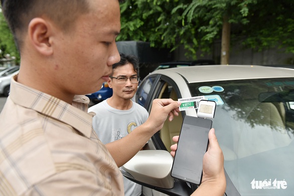 Bị áp hạn chót, thu phí không dừng phải chạy nước rút - Ảnh 1. Bị áp hạn chót, thu phí không dừng phải chạy nước rút - Ảnh 1.