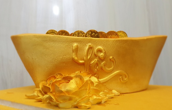 Giới trẻ săn bánh kem chuột vàng đội mũ thần tài - Ảnh 10. Giới trẻ săn bánh kem chuột vàng đội mũ thần tài - Ảnh 10.