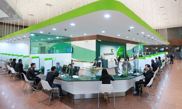 Vietcombank giảm phí dịch vụ chuyển tiền nhanh liên ngân hàng 24/7 - Ảnh 1. Vietcombank giảm phí dịch vụ chuyển tiền nhanh liên ngân hàng 24/7 - Ảnh 1.