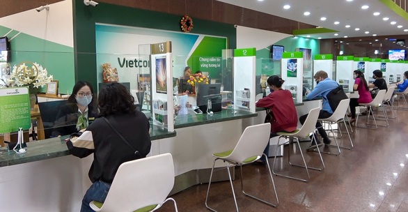 Vietcombank tiếp tục giảm lãi vay cho khách hàng bị ảnh hưởng dịch COVID - Ảnh 1. Vietcombank tiếp tục giảm lãi vay cho khách hàng bị ảnh hưởng dịch COVID - Ảnh 1.