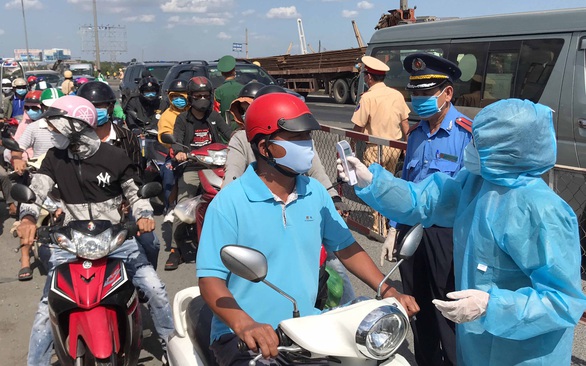Kiểm soát người và xe đến TP.HCM cụ thể như thế nào? - Ảnh 1. Kiểm soát người và xe đến TP.HCM cụ thể như thế nào? - Ảnh 1.
