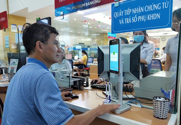 Xác thực vân tay, khuôn mặt khi giao dịch ngân hàng lên ngôi - Ảnh 1. Xác thực vân tay, khuôn mặt khi giao dịch ngân hàng lên ngôi - Ảnh 1.