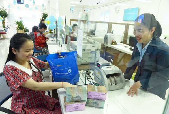 Ngân hàng Nhà nước yêu cầu các ngân hàng giảm lãi suất cho vay thực chất - Ảnh 1. Ngân hàng Nhà nước yêu cầu các ngân hàng giảm lãi suất cho vay thực chất - Ảnh 1.