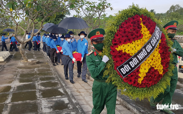 Lễ truy điệu và cải táng 54 hài cốt liệt sĩ quân tình nguyện Việt Nam hy sinh qua các thời kỳ - Ảnh 1.