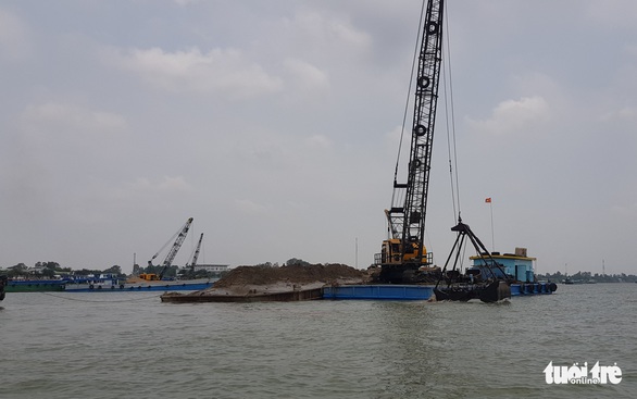 Doanh nghiệp trúng đấu giá mỏ cát trên sông Hậu đã nộp hơn 50 tỉ đồng - Ảnh 1. Doanh nghiệp trúng đấu giá mỏ cát trên sông Hậu đã nộp hơn 50 tỉ đồng - Ảnh 1.