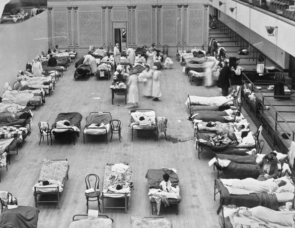 COVID-19 cướp đi mạng sống của 675.000 người Mỹ, tương đương đại dịch cúm 1918 - Ảnh 1.