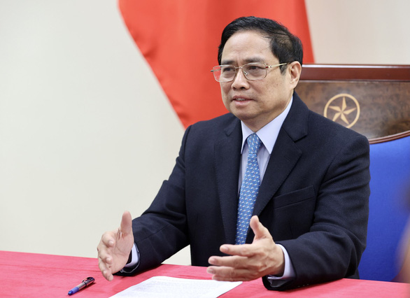 Thủ tướng Phạm Minh Chính điện đàm với Thủ tướng Trung Quốc, giải quyết vấn đề ách tắc tại cửa khẩu - Ảnh 1.