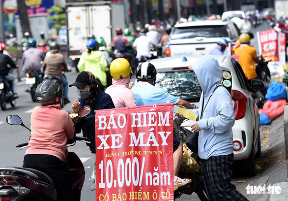 Bỏ bảo hiểm bắt buộc với xe máy là hợp lý - Ảnh 1.