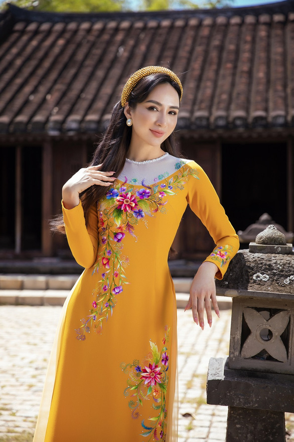 Hoa hậu Ngọc Diễm duyên dáng trong tà áo dài Minh Châu sau kết thúc nhiệm kỳ 14 năm - Ảnh 5.