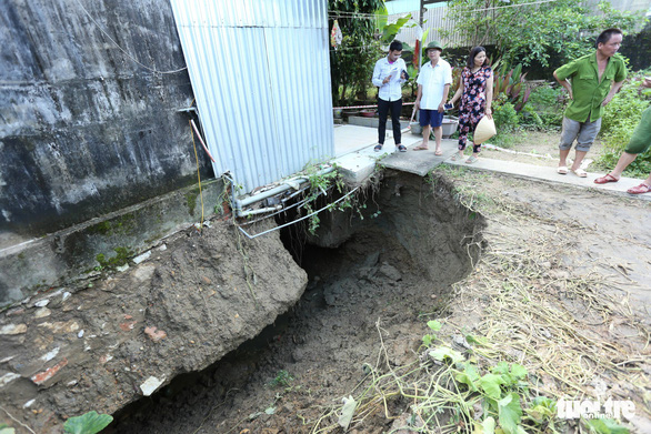 Why are there dozens of 'death pits' in one commune?  - Photo 1.