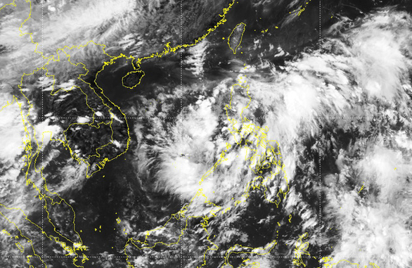 Vùng áp thấp ở Philippines có khả năng mạnh lên thành áp thấp nhiệt đới/bão trên Biển Đông - Ảnh 1.