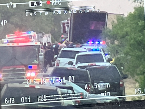 Nearly 50 bodies of suspected migrants were discovered in and around a tractor trailer in the US - Photo 1.