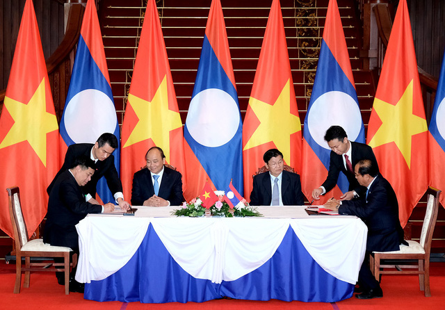 Việt - Lào ký kết nhiều văn kiện hợp tác về năng lượng - Ảnh 1.