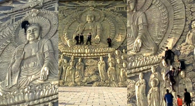 Du khách Trung Quốc leo lên đầu tượng Phật - Ảnh 1.
