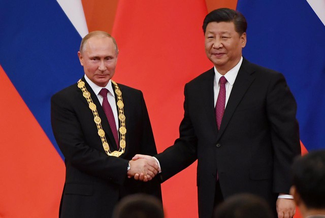Ông Tập trao huân chương Hữu nghị đầu tiên cho ‘người bạn tốt nhất’ Putin - Ảnh 1.