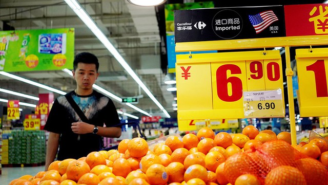 Mỹ - Trung vừa đánh vừa đàm - Ảnh 1.