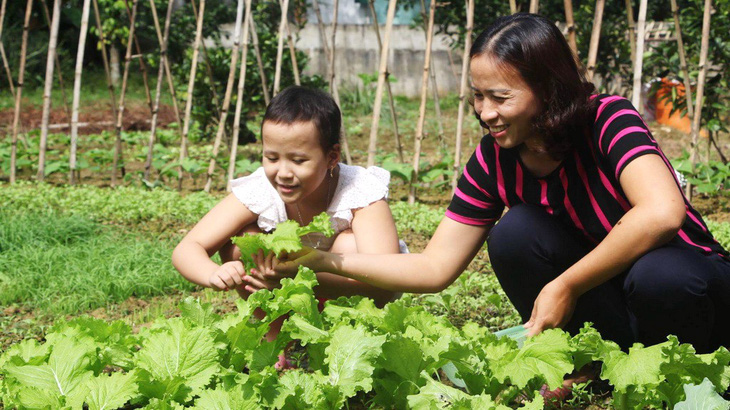 Vượt qua nỗi đau ung thư: Nghị lực sống của mẹ con cô giáo - Ảnh 1.