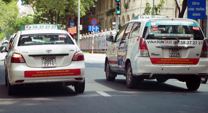Uber và Grab có thể kiện ngược tài xế xe Vinasun? - Ảnh 1.