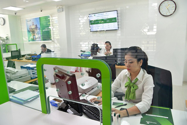 Vietcombank muốn chiếm lĩnh thị trường tài chính Lào - Ảnh 1.