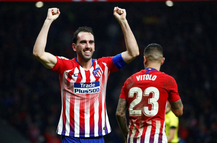 Nén đau, Godin ghi bàn thắng vàng cho Atletico Madrid - Ảnh 2.