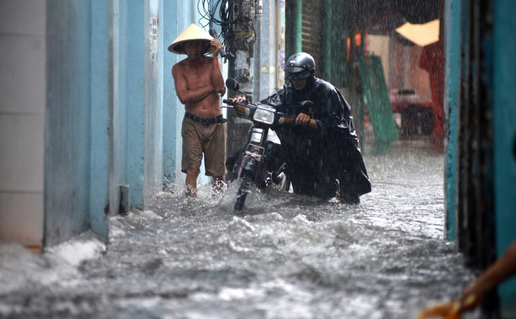 Sài Gòn và Nam Bộ mưa, mưa to dịp Tết dương lịch do áp thấp - Ảnh 1.