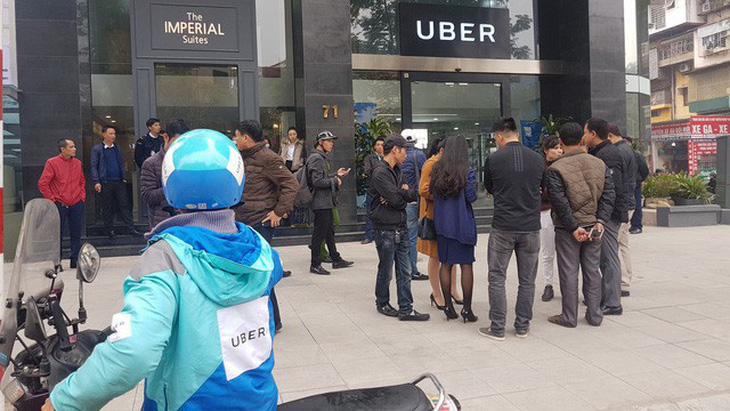 Đến hạn, Grab vẫn chưa báo cáo vụ mua lại Uber - Ảnh 1.