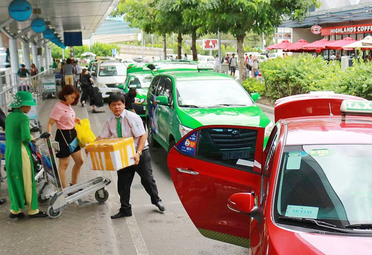 Quy định quản lý taxi: Nơi ủng hộ, nơi rụt rè - Ảnh 1.