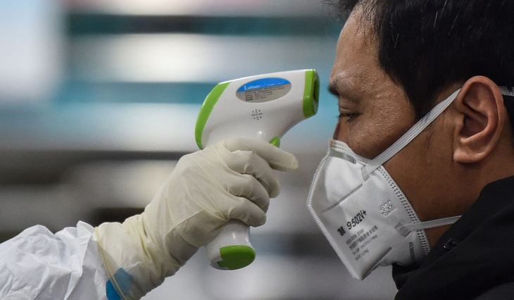 Trung Quốc kéo dài kỳ nghỉ tết để tập trung đối phó virus corona - Ảnh 1.