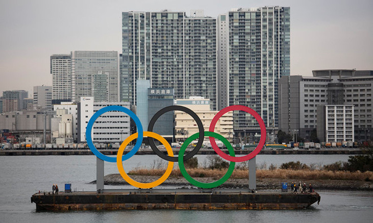 Nhiều thành viên Ủy ban Olympic Tokyo đồng ý hoãn giải đấu - Ảnh 1.