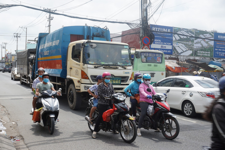 Từ 28-3: cấm xe trên 5 tấn chạy vào quốc lộ 50 trong giờ cao điểm - Ảnh 1.