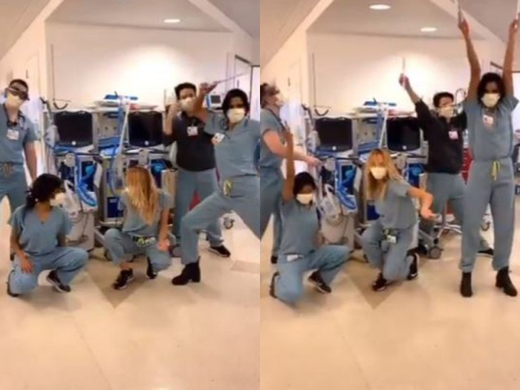 Bác sĩ nhảy điệu bắt chân thay vì bắt tay cổ vũ mọi người chống dịch - Ảnh 1.