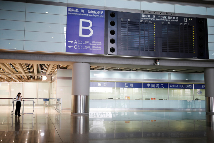 Bắc Kinh hủy gần 70% chuyến bay để dập dịch COVID-19 - Ảnh 1.