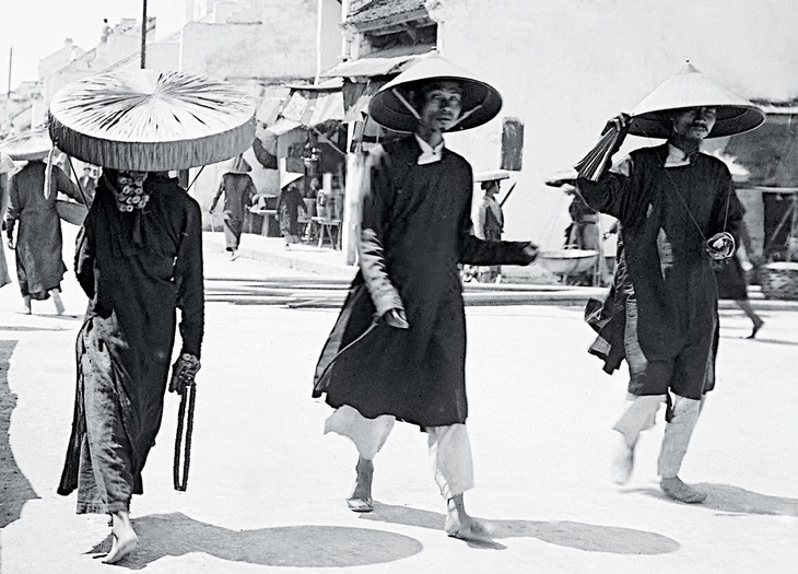 Chiếc nón lá dãi nắng dầm mưa cùng người Việt - Ảnh 1.