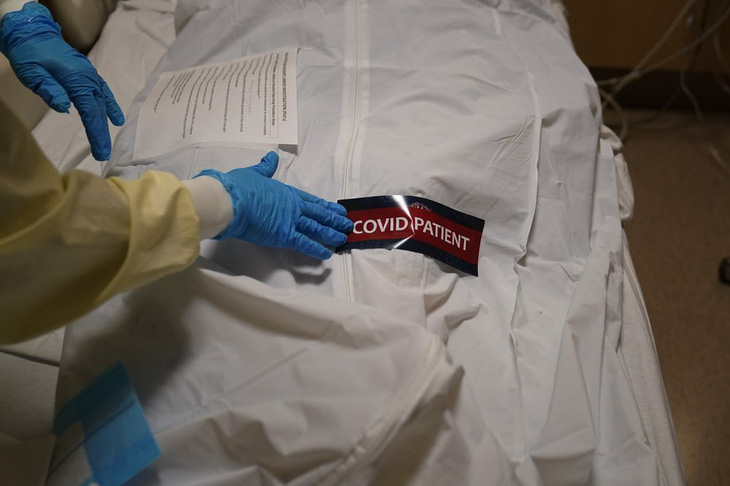Mỹ: Hơn 450.000 người chết vì COVID-19, đã tiêm vắc xin 36,7 triệu người - Ảnh 1.