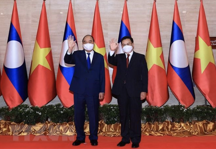 Chủ tịch nước Nguyễn Xuân Phúc: Quan hệ Việt - Lào cao hơn các hiệp định, hiệp ước - Ảnh 1.