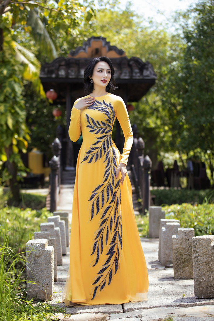 Hoa hậu Ngọc Diễm duyên dáng trong tà áo dài Minh Châu sau kết thúc nhiệm kỳ 14 năm - Ảnh 13.
