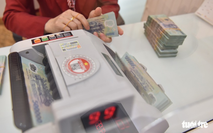 300 triệu đồng và thanh toán không tiền mặt - Ảnh 1.