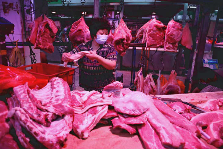 Trung Quốc sẵn sàng mở kho dự trữ thịt lợn để kiểm soát lạm phát - Ảnh 1.