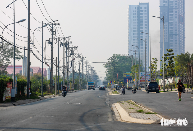 Tết Nguyên đán 2023, dân quận 7 phấn khởi với nhiều con hẻm được mở rộng - Ảnh 6.