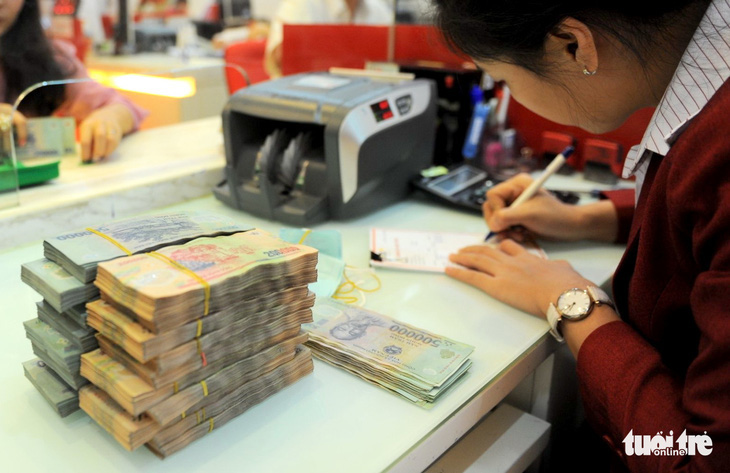 Theo ông Đào Minh Tú, phó thống đốc Ngân hàng Nhà nước, ngân hàng phải tháo gỡ khó khăn cho doanh nghiệp - Ảnh: TỰ TRUNG